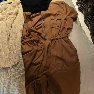 Woman used clothes.. Well taken care off. Dress, 2 cardigans,romper 3 shirts